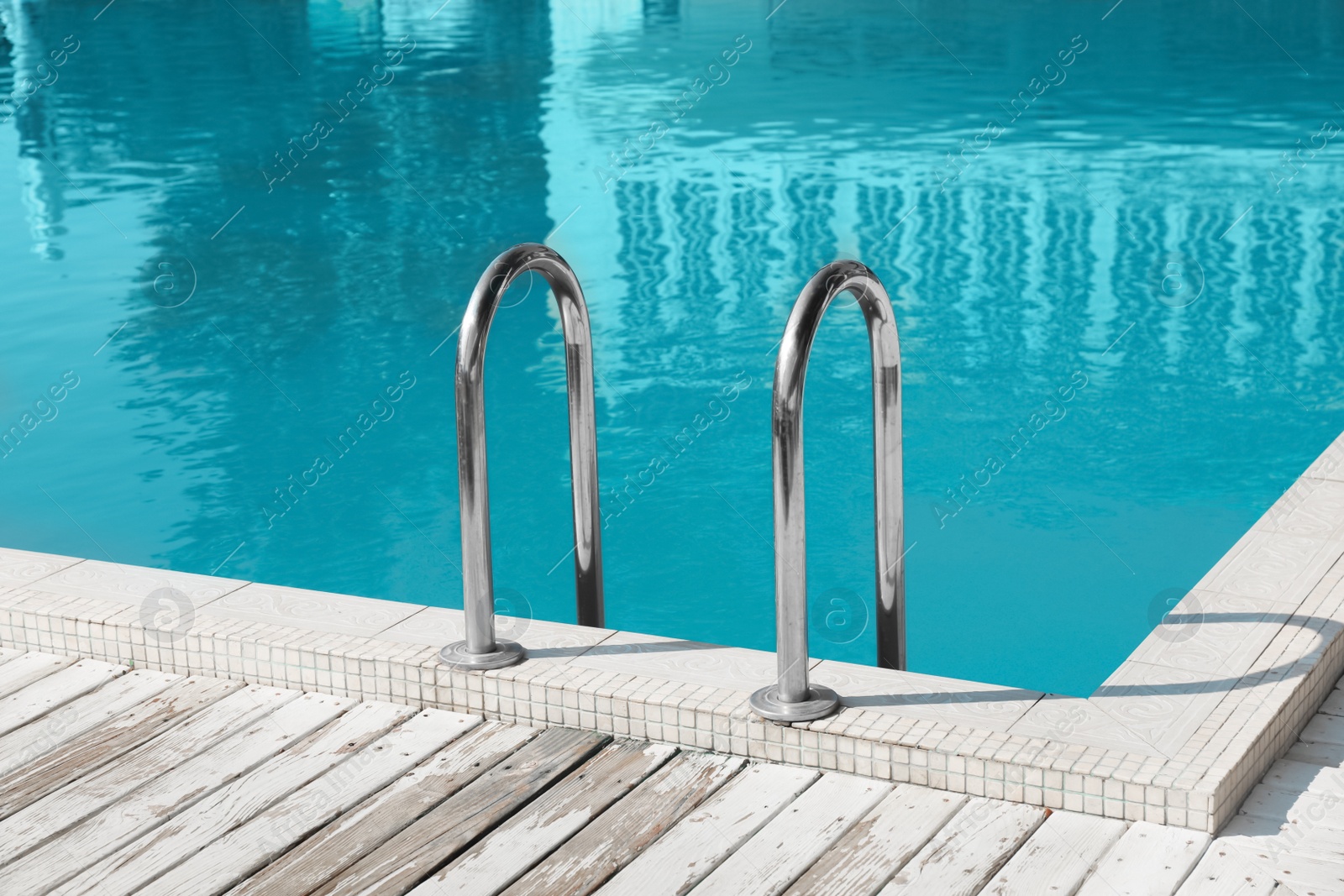 Photo of Modern swimming pool with ladder at resort