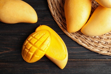 Photo of Flat lay composition with mango on wooden background