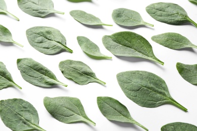 Photo of Fresh green healthy spinach leaves on white background