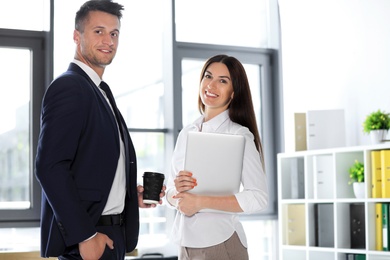 Portrait of business trainers in office wear at workplace