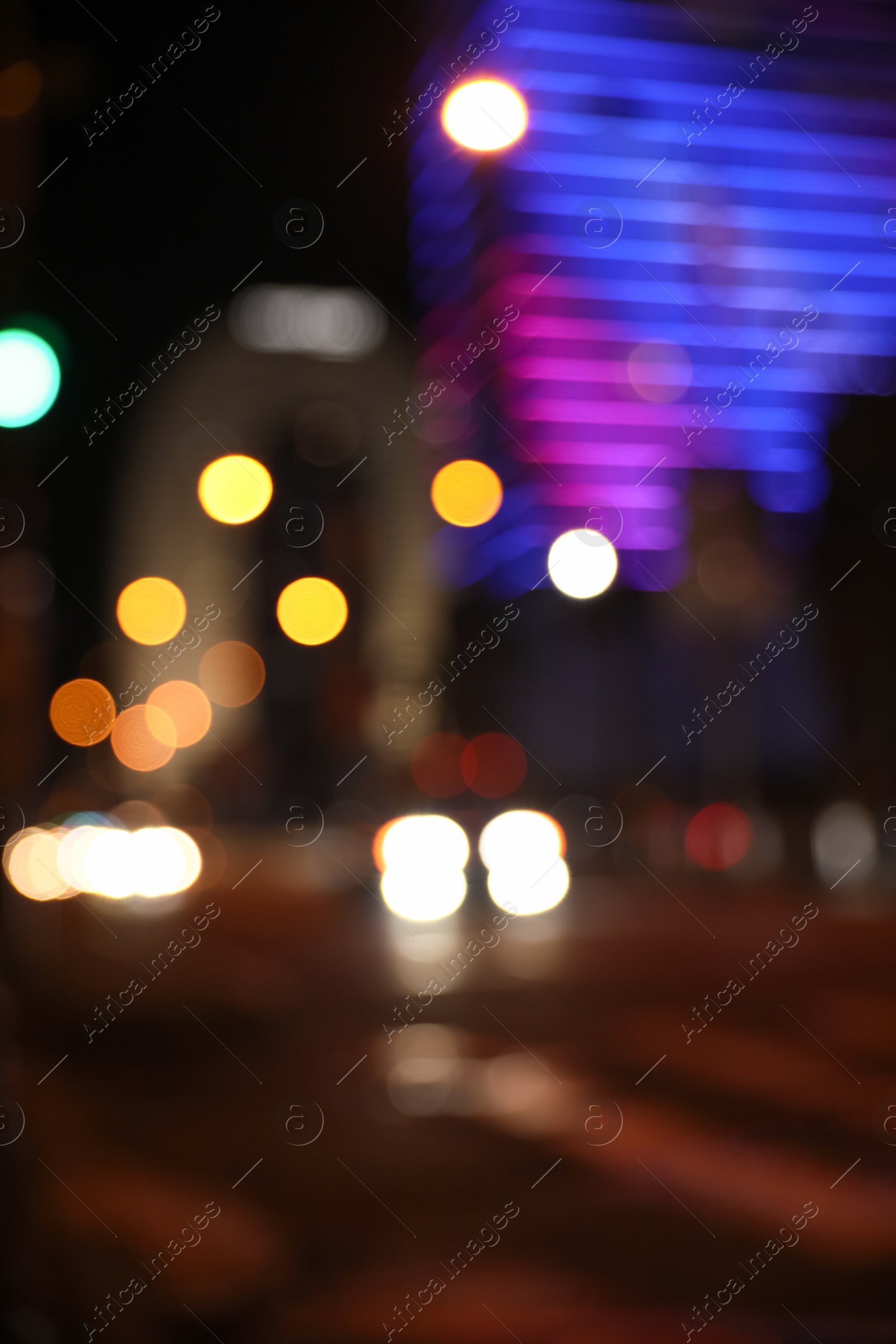 Photo of Blurred view of cityscape with bokeh effect. Night life