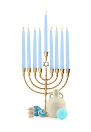 Photo of Hanukkah celebration. Menorah with light blue candles, dreidels and festive baubles isolated on white