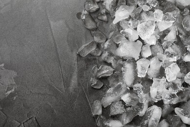 Photo of Pile of crushed ice on grey table, top view. Space for text