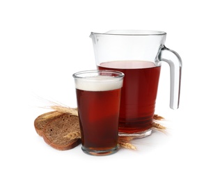 Photo of Delicious kvass, bread and spikes on white background