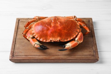 Delicious boiled crab on white wooden table