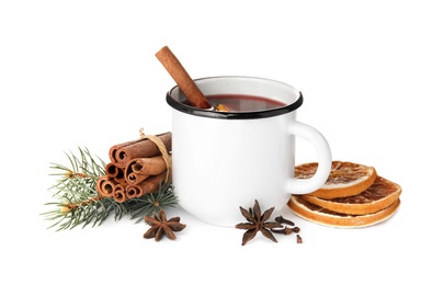 Photo of Composition with mug of mulled wine, cinnamon, orange and fir branch on white background