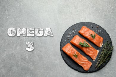 Omega 3. Fresh cut salmon, herbs and spices on grey table, top view