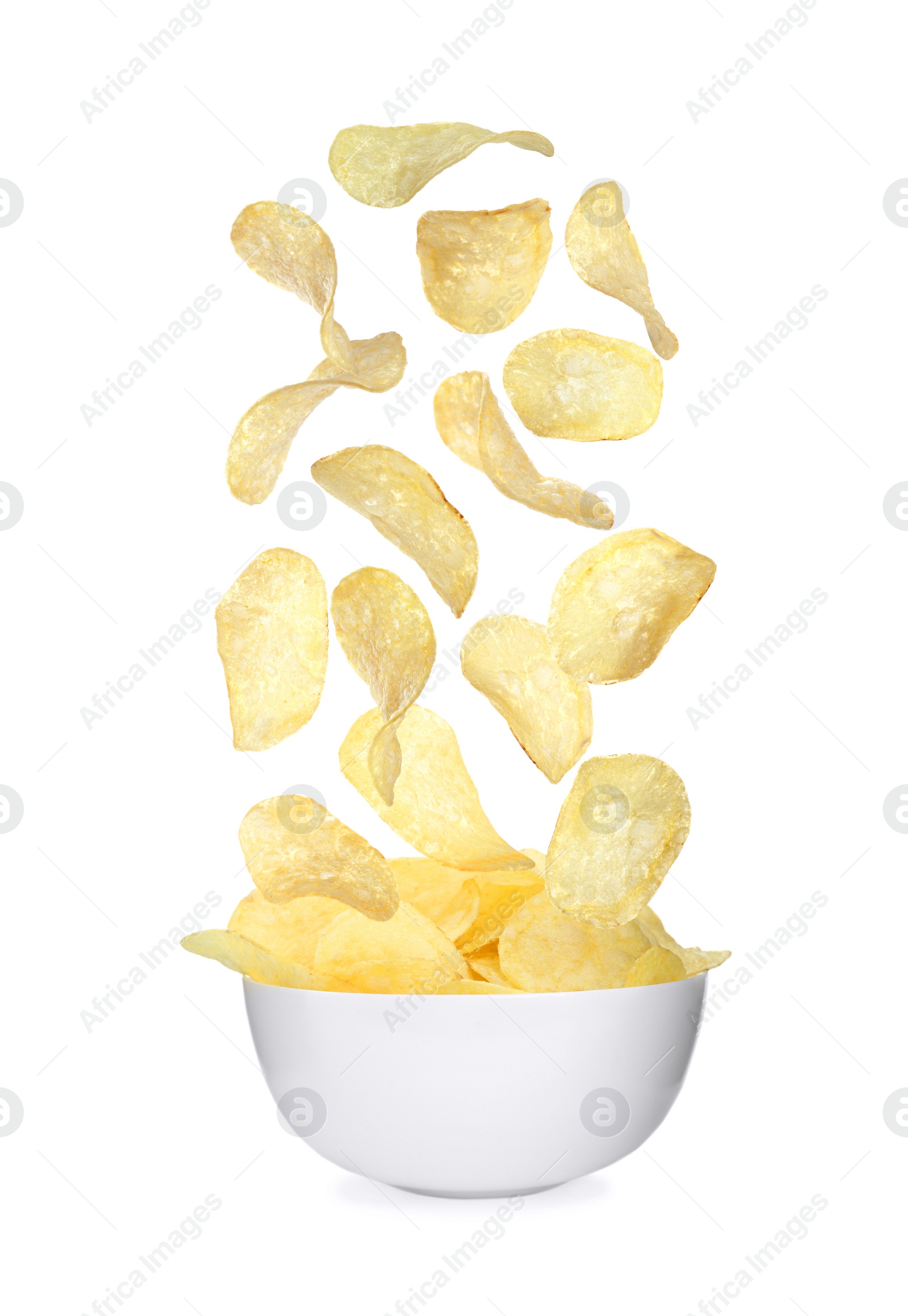 Image of Fried crispy potato chips falling into bowl on white background