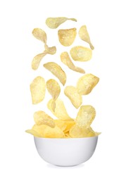 Fried crispy potato chips falling into bowl on white background