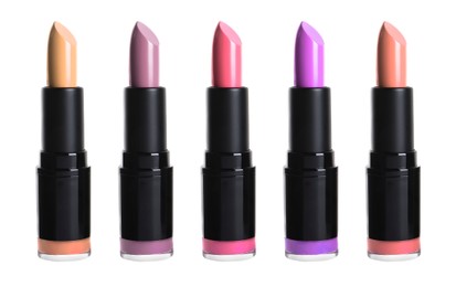 Set with different beautiful lipsticks on white background