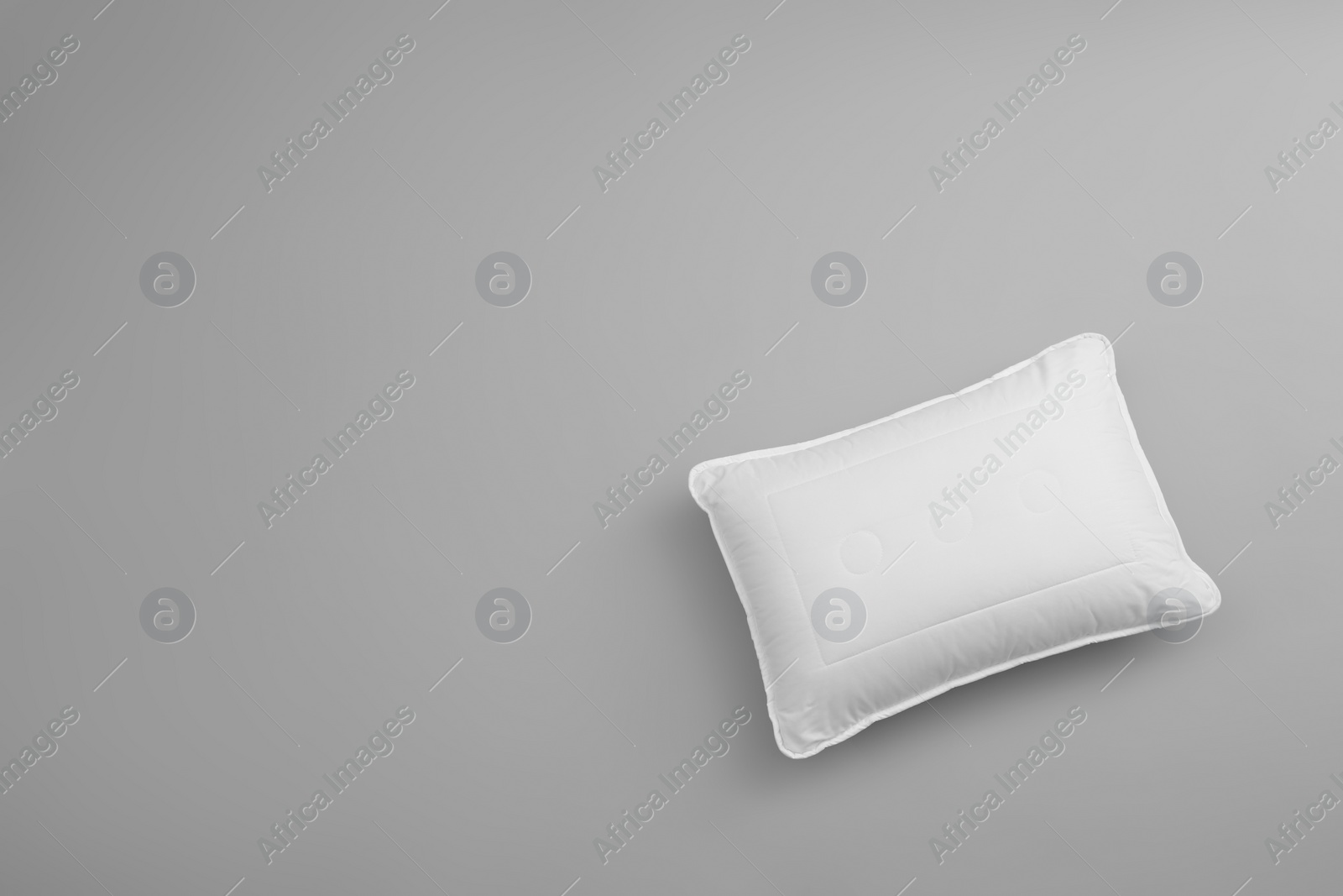 Photo of Clean soft bed pillow on grey background, top view