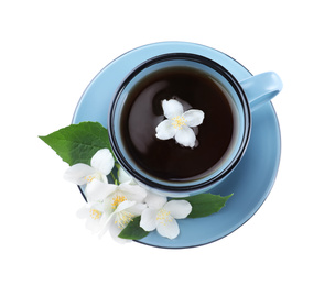 Photo of Cup of tea and fresh jasmine flowers isolated on white, top view