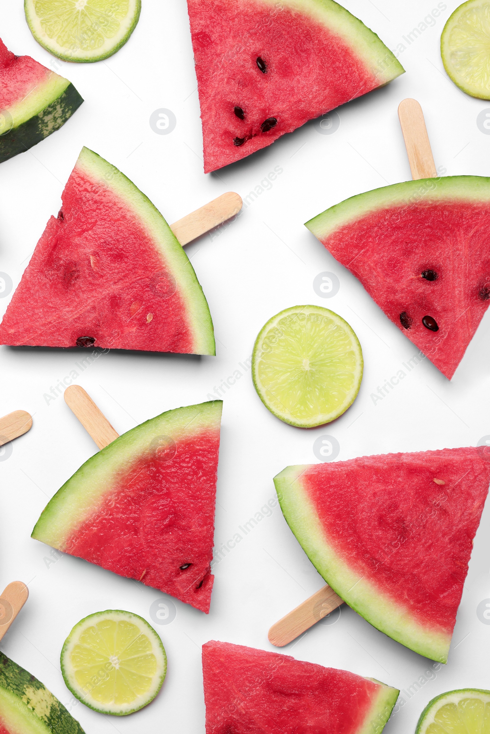 Photo of Tasty sliced watermelon and lime on white background, top view