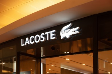 Photo of Warshaw, Poland - May 14, 2022: Lacoste fashion store in shopping mall