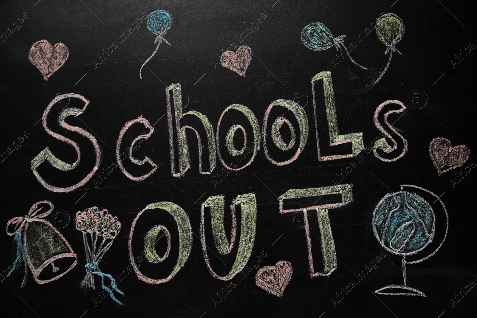 Photo of Text SCHOOL'S OUT and different drawings on blackboard. Summer holidays