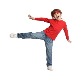 Photo of Happy little boy dancing on white background