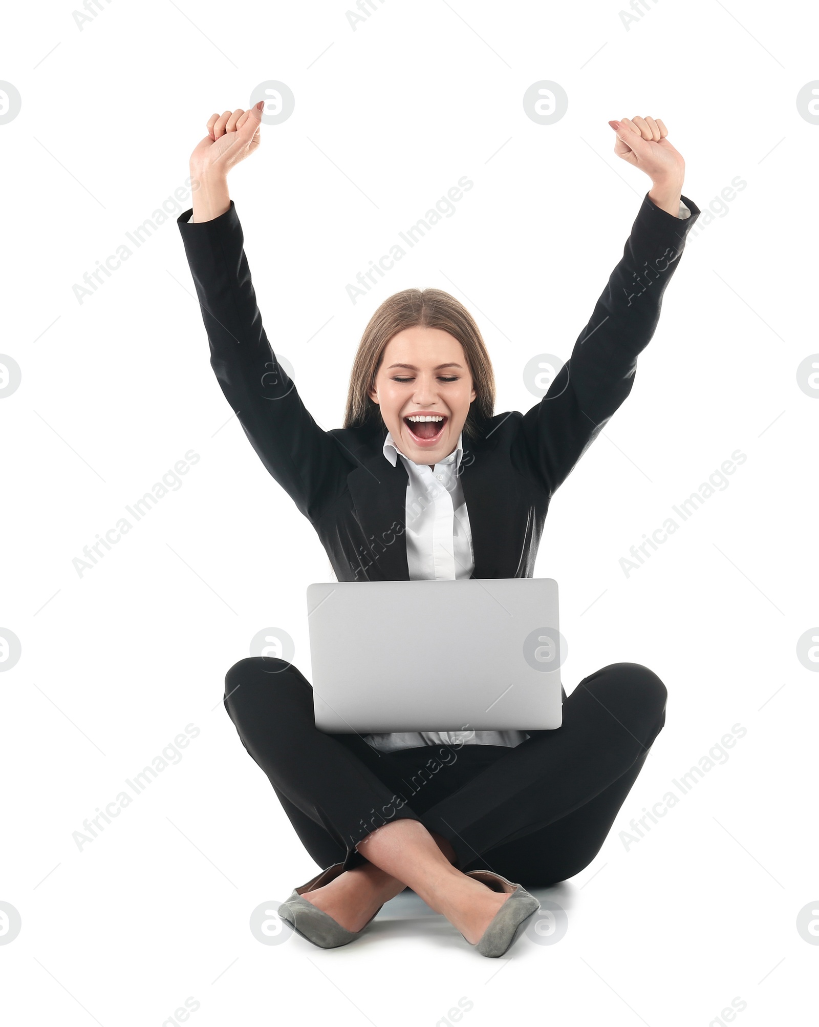 Photo of Emotional businesswoman in office wear with laptop celebrating victory on white background