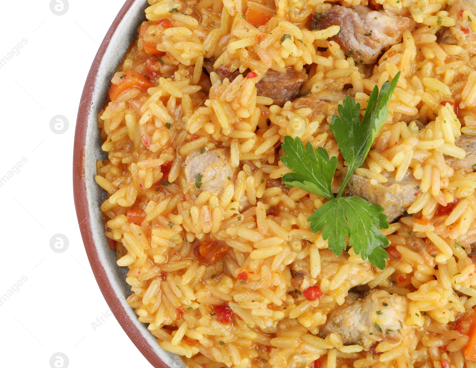 Photo of Delicious pilaf with meat isolated on white, top view