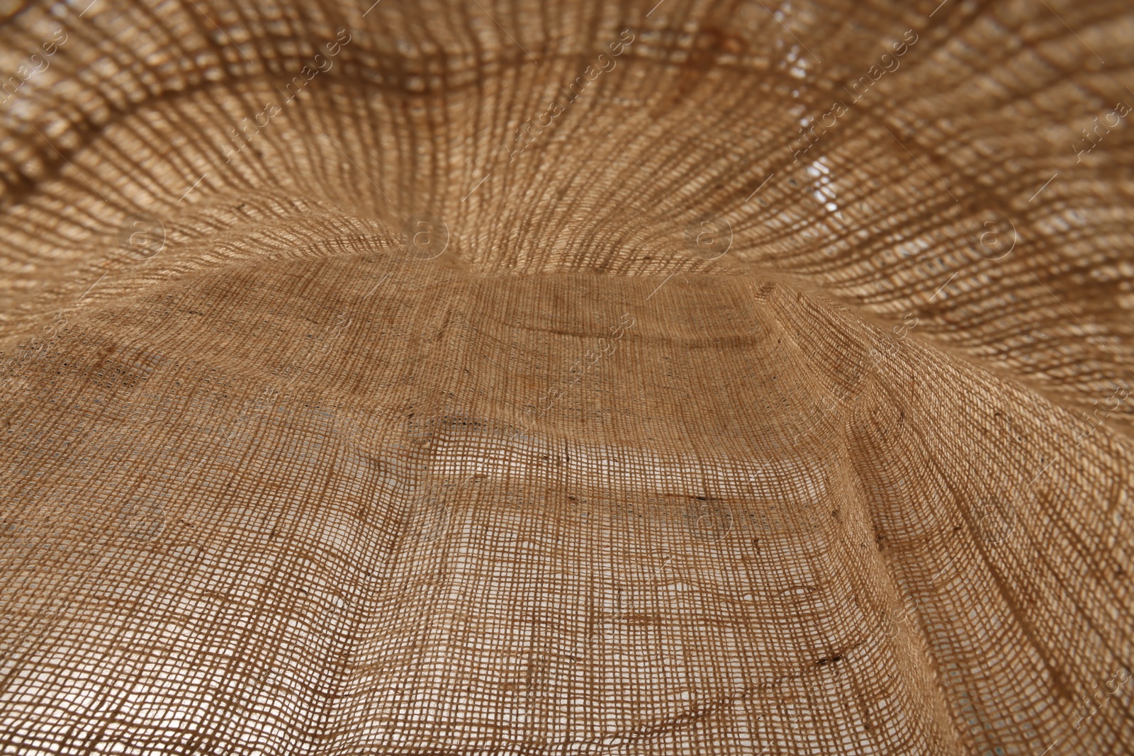 Photo of Texture of natural burlap fabric as background, closeup