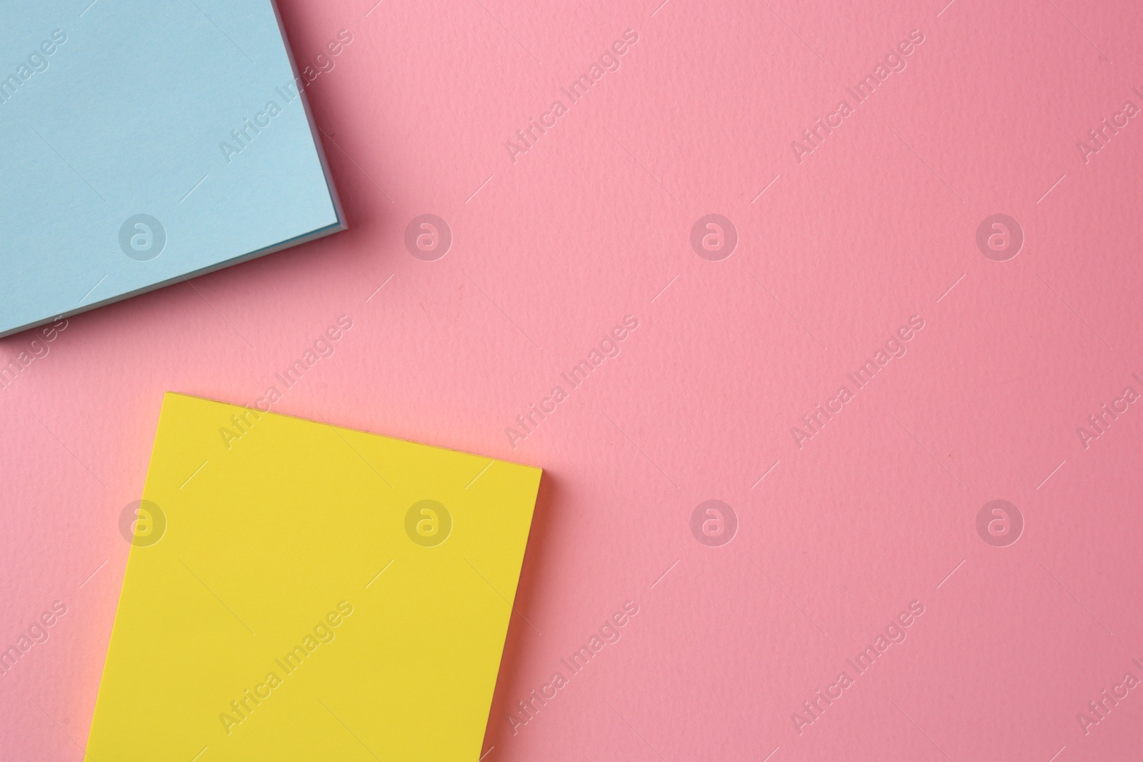 Photo of Blank paper notes on pink background, flat lay. Space for text