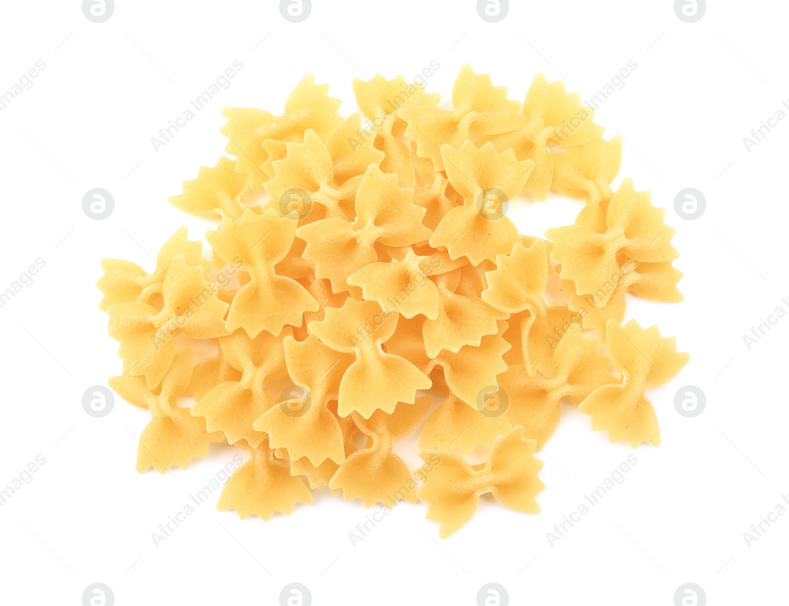 Photo of Pile of raw farfalle pasta isolated on white, top view