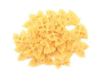 Photo of Pile of raw farfalle pasta isolated on white, top view