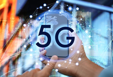 Image of Man using smartphone with 5G network system outdoors, closeup 