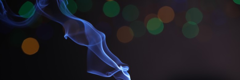 Image of Smoke against blurred lights, space for text. Banner design