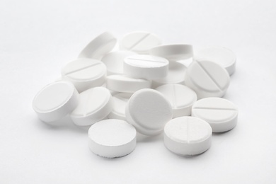 Photo of Heap of pills on white background