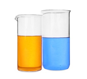 Glass beakers with colorful liquids on white background