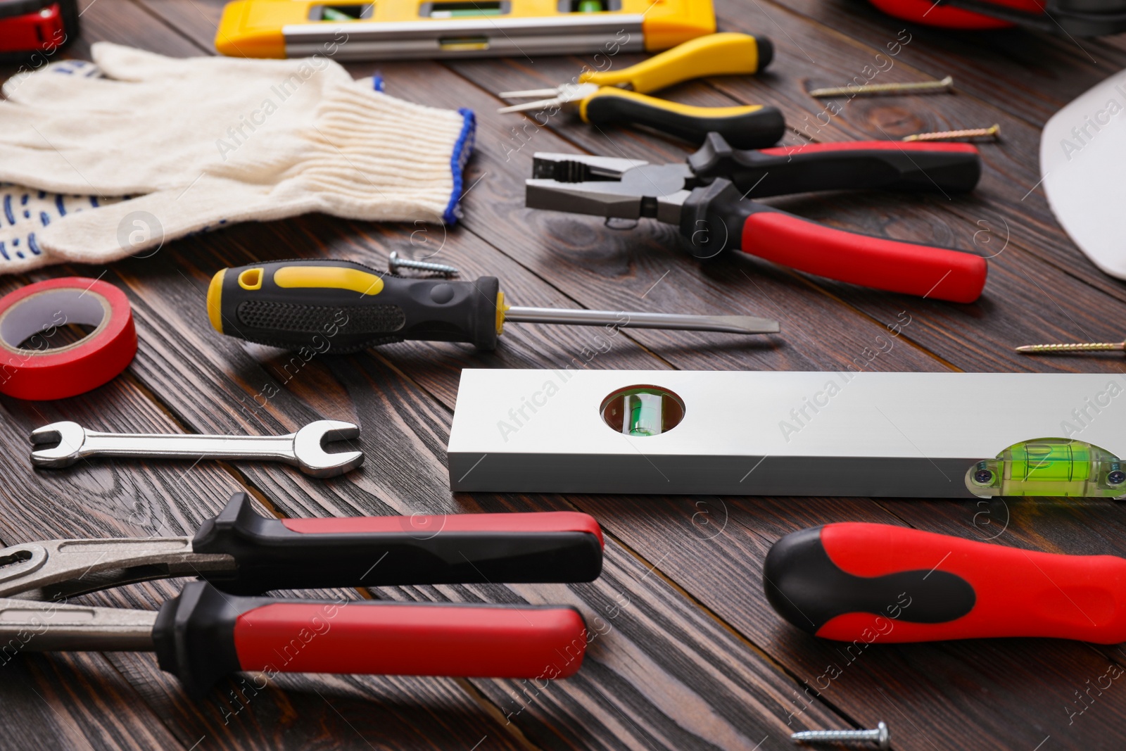 Photo of Different modern construction tools on wooden background