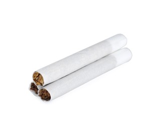 Photo of Hand rolled tobacco cigarettes on white background