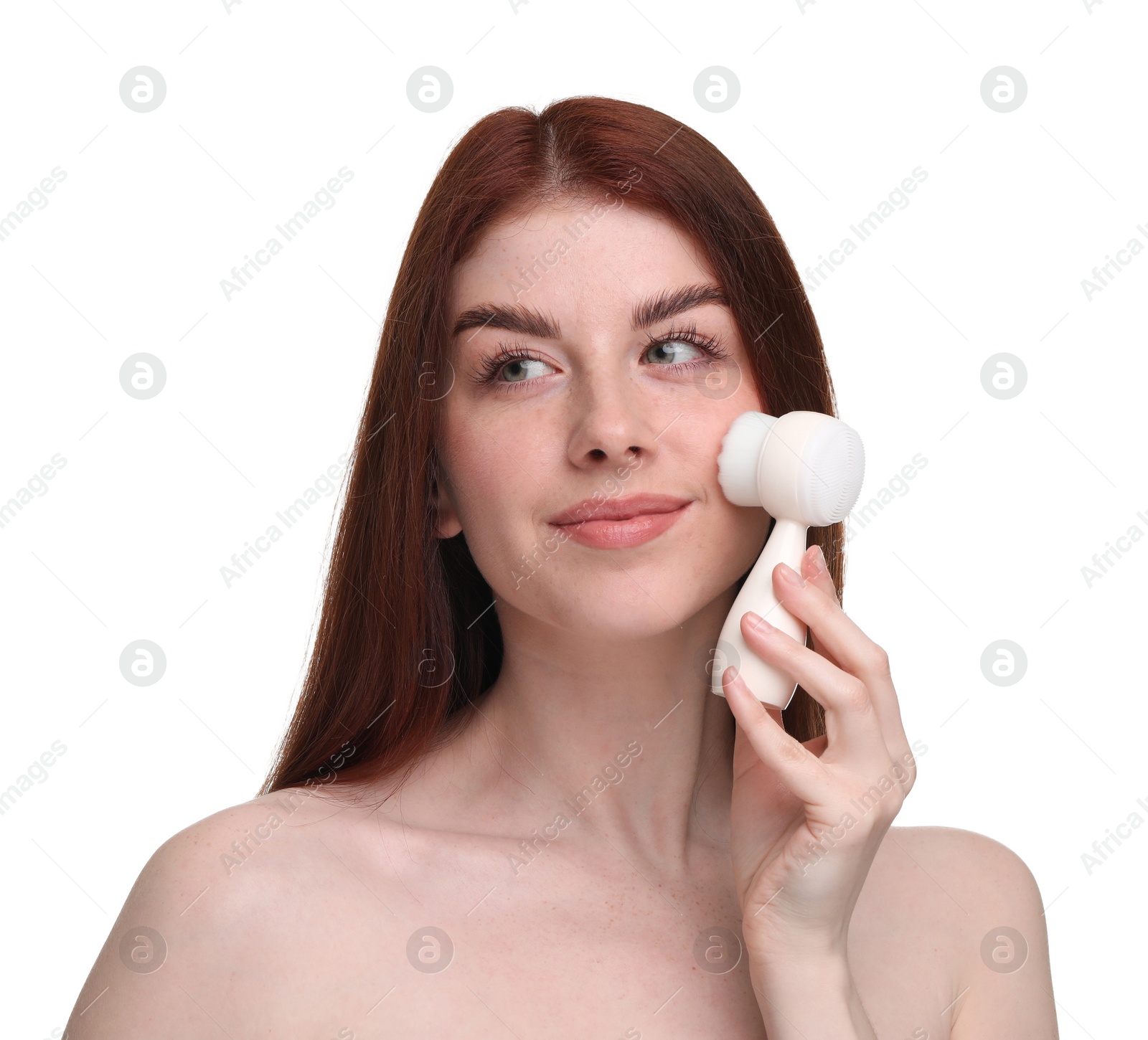 Photo of Washing face. Young woman with cleansing brush on white background