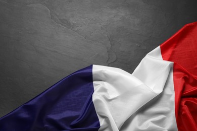 Photo of Flag of France on black background, top view. Space for text