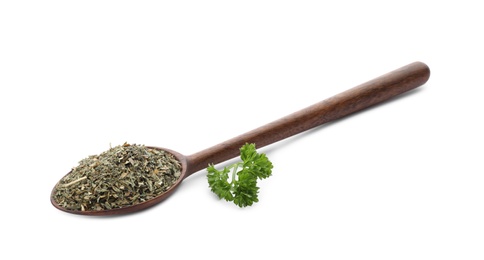 Photo of Wooden spoon with dried parsley on white background