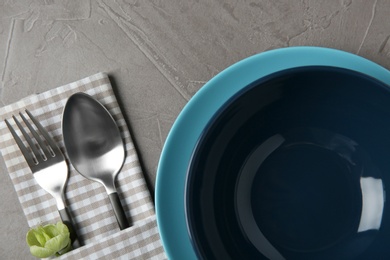 Beautiful table setting on grey background, flat lay