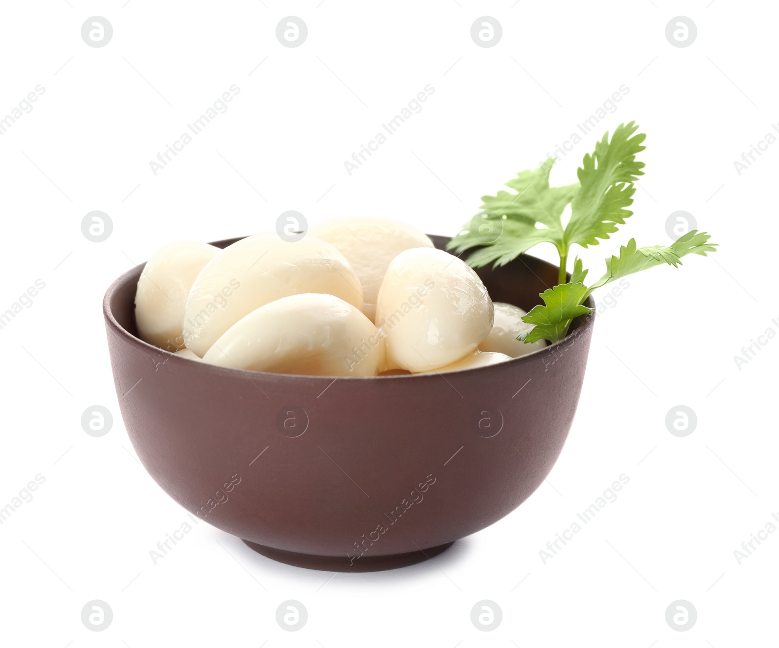 Photo of Bowl with preserved garlic and parsley on white background