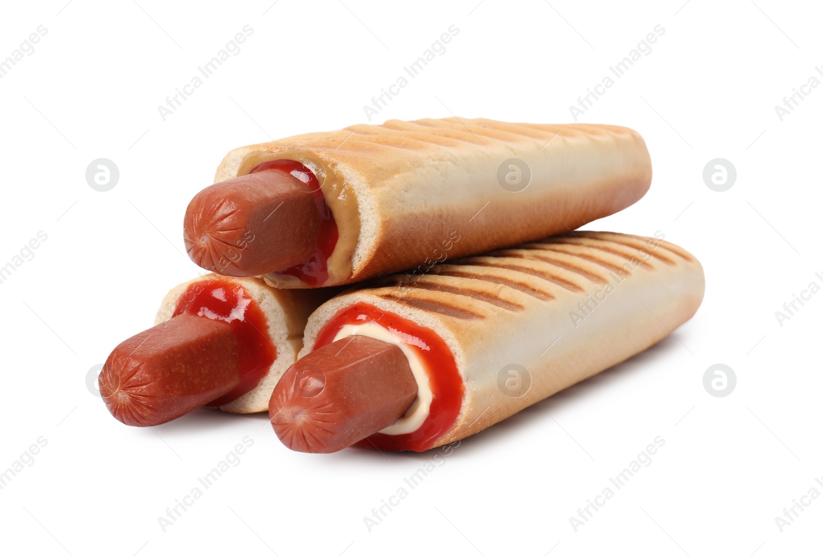 Photo of Tasty french hot dogs with different sauces on white background