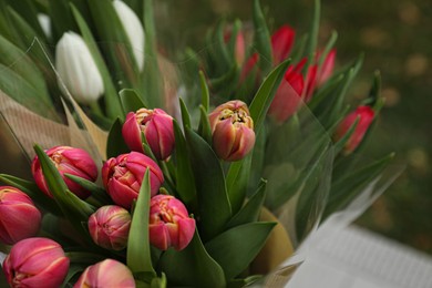 Photo of Beautiful bouquets of colorful tulips outdoors, closeup