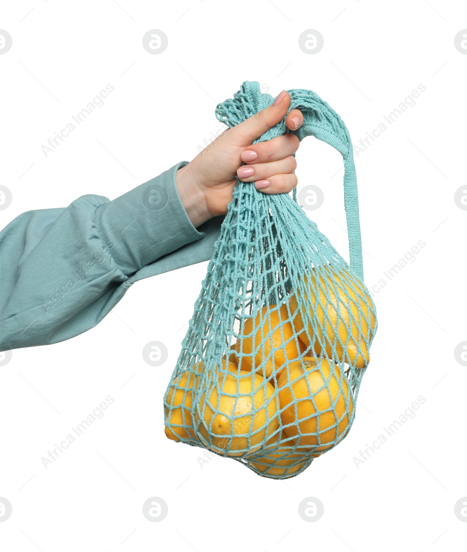 Photo of Woman with string bag of fresh lemons on white background, closeup