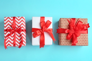 Photo of Different gift boxes on color background, flat lay