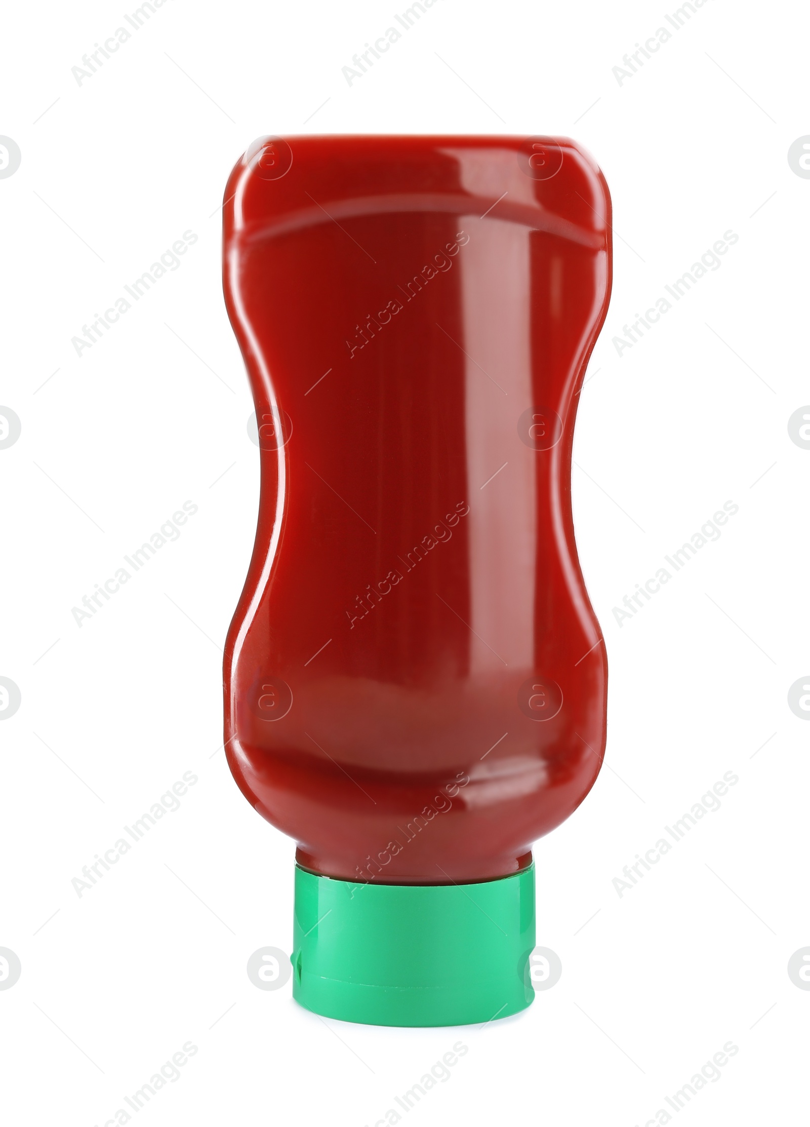 Photo of Bottle of tasty ketchup isolated on white