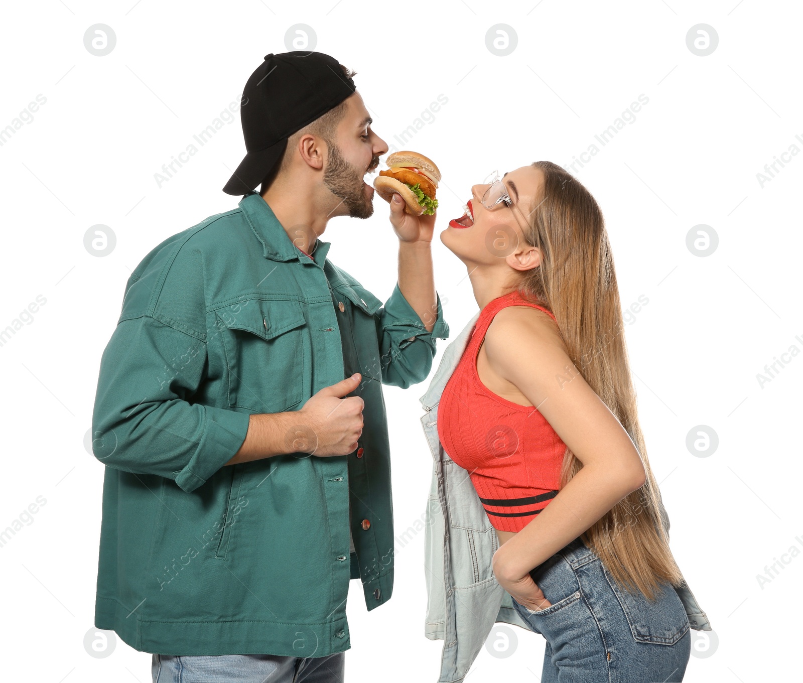 Photo of Happy couple eating burger isolated on white