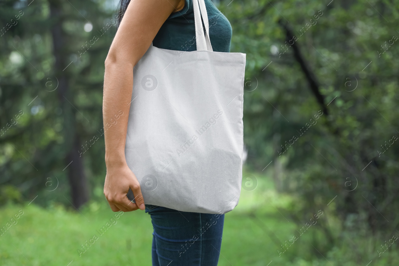 Photo of Woman with eco bag outdoors. Mockup for design