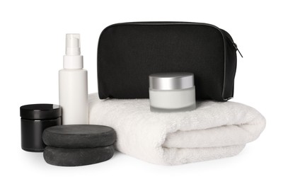 Photo of Compact toiletry bag, spa stones and different cosmetic products isolated on white