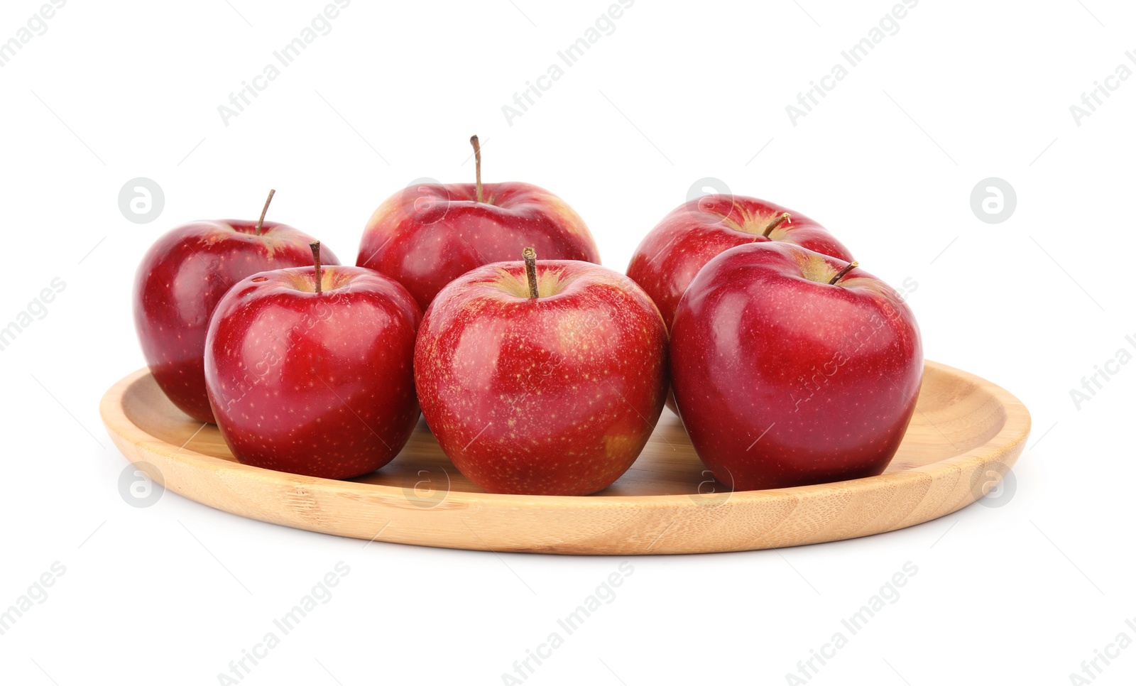 Photo of Wooden plate of ripe juicy red apples on white background