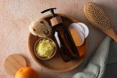 Flat lay composition with natural body scrub on beige textured table. Anti cellulite treatment