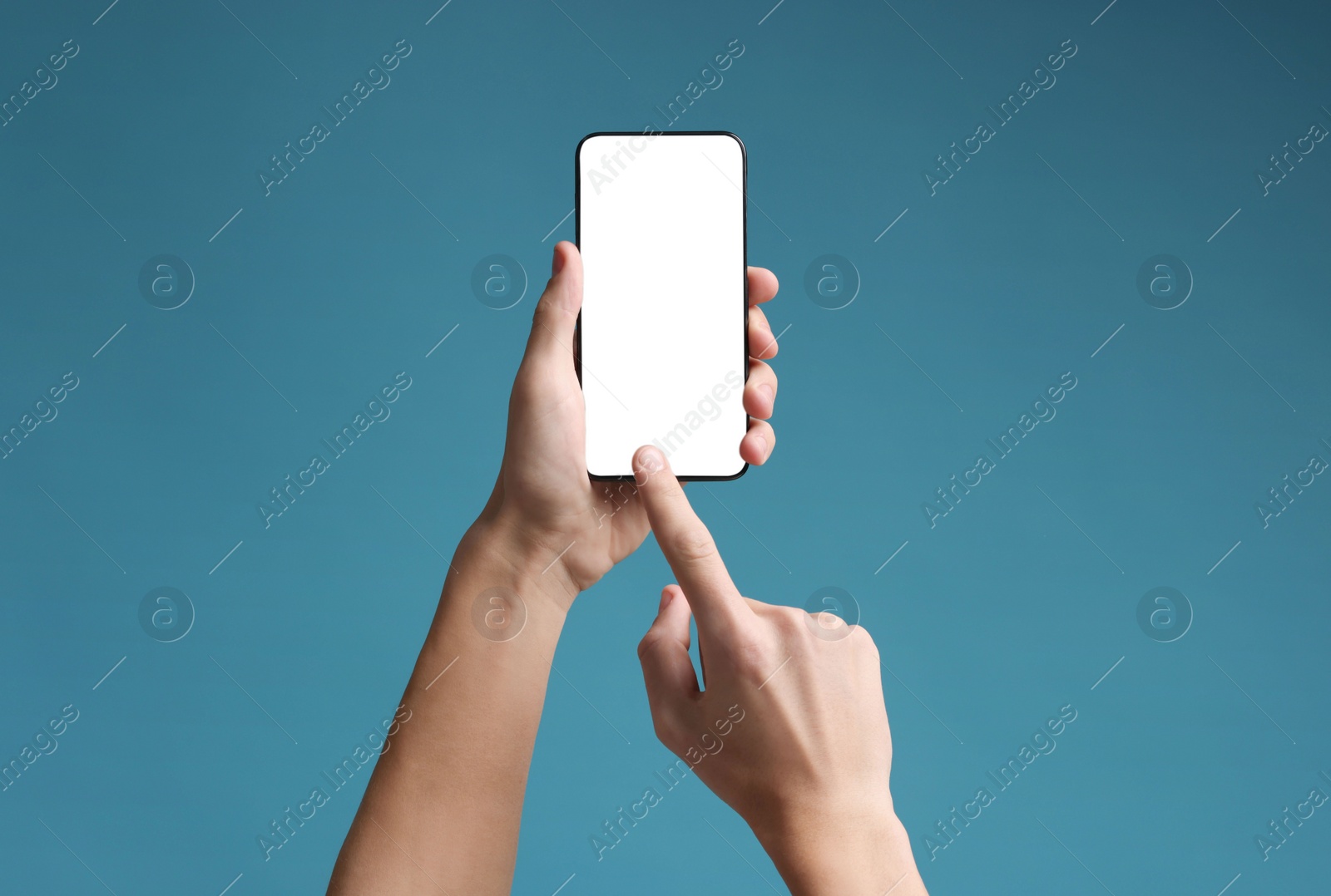 Photo of Man using smartphone with blank screen on light blue background, closeup. Mockup for design