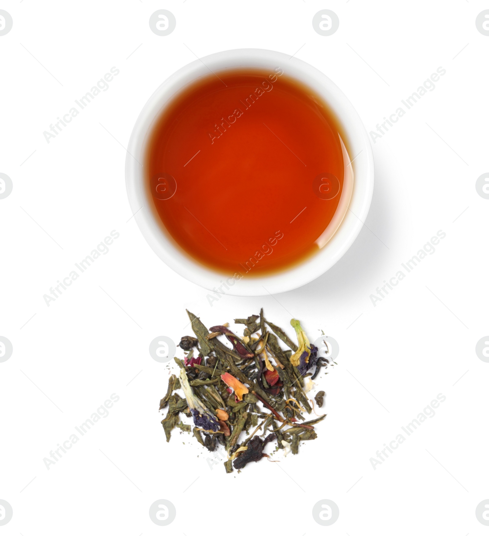 Photo of Freshly brewed tea and dry leaves on white background, top view