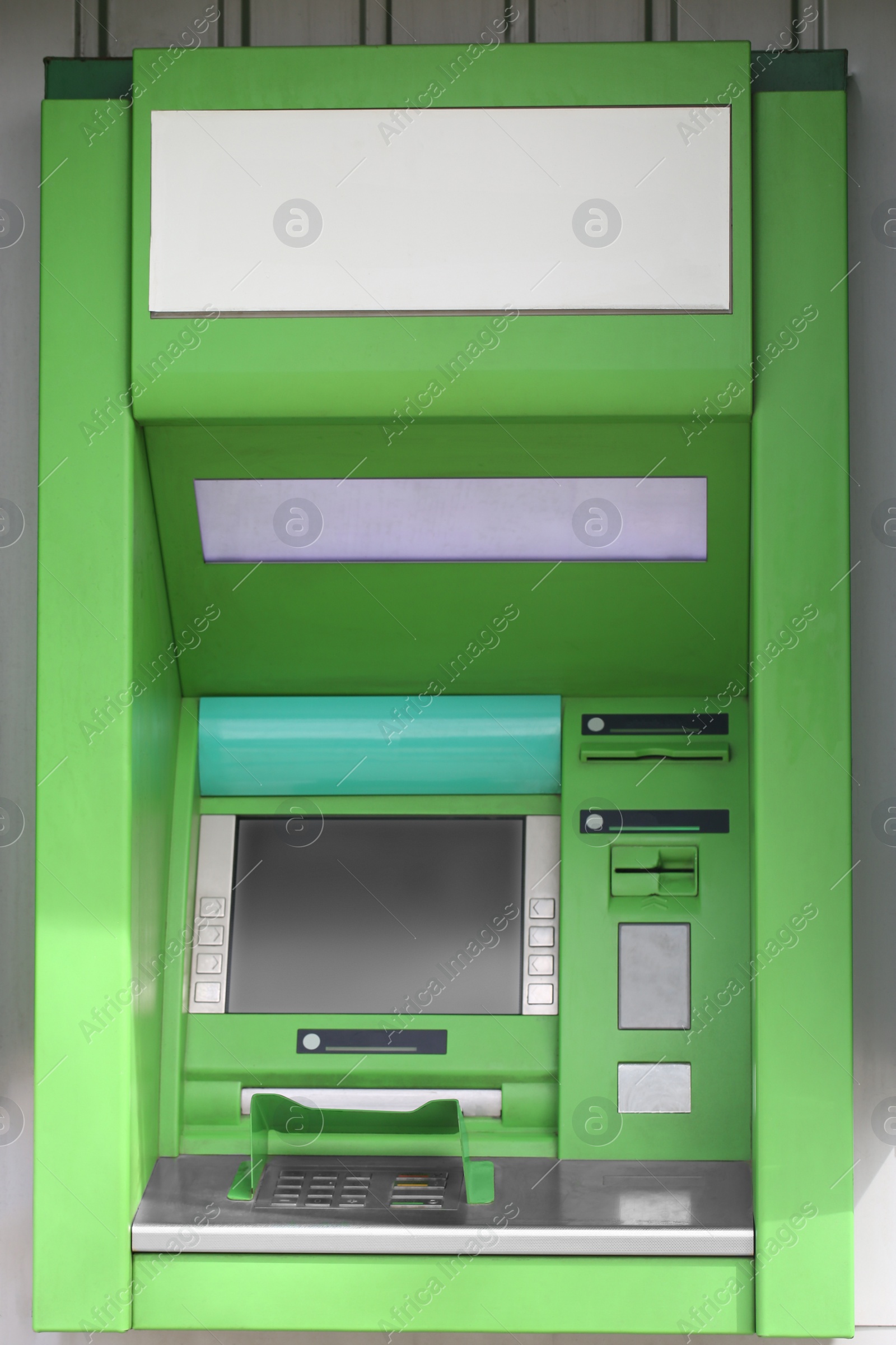 Photo of Modern automated cash machine with screen outdoors